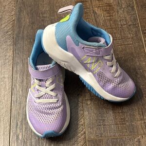 Purple and blue New Balance Rave Run v2